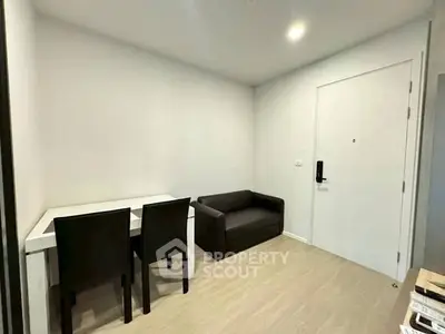 Cozy small living area with modern furniture and bright lighting