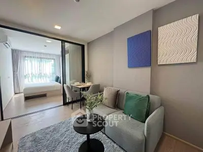 Modern living room with cozy sofa and stylish decor in open-plan apartment