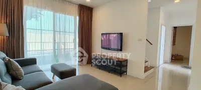 Modern living room with large windows and stylish furniture