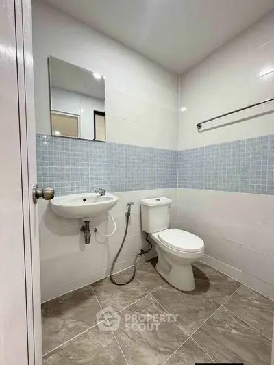 Modern bathroom with sleek fixtures and stylish tile design, perfect for contemporary living.