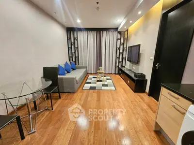 Modern living room with sleek design and wooden flooring