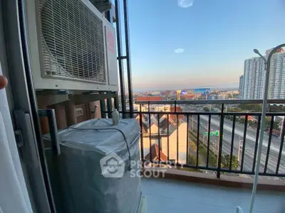 Spacious balcony with city view and air conditioning unit, perfect for urban living.