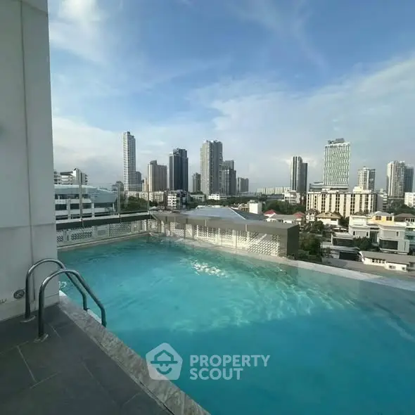 Stunning rooftop pool with panoramic city skyline views