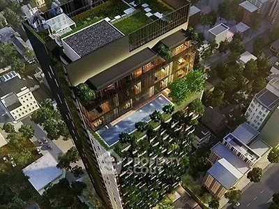 Stunning aerial view of a modern high-rise building with lush greenery and rooftop pool.