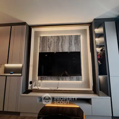 Modern living room with stylish TV wall unit and ambient lighting