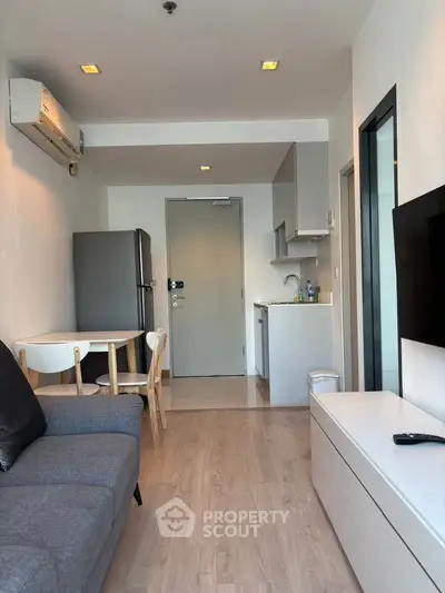 Modern apartment living room with open kitchen and stylish furniture