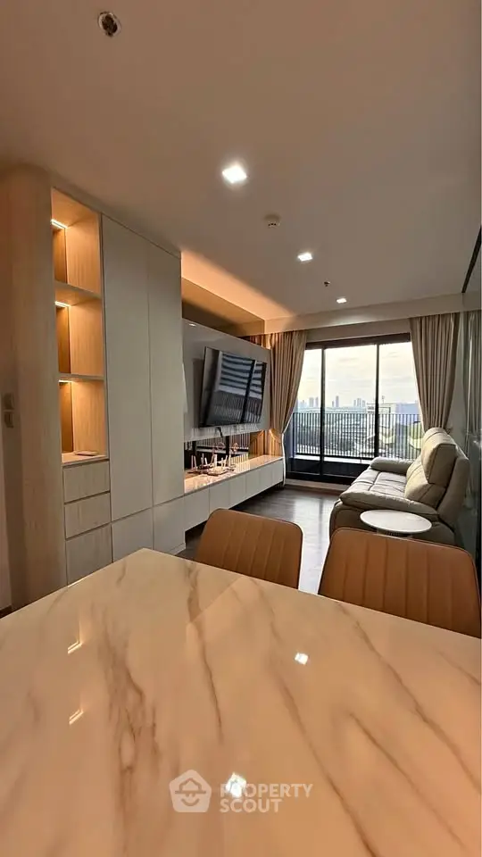 Modern living room with city view and elegant marble dining table