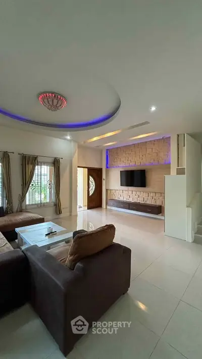 Spacious modern living room with elegant lighting and stylish decor