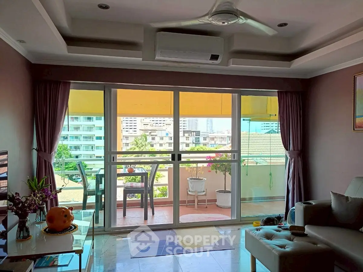 Spacious living room with balcony view in modern apartment