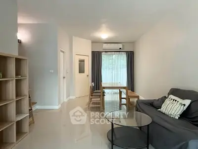 Modern living room with sleek furniture and natural light, perfect for cozy gatherings.
