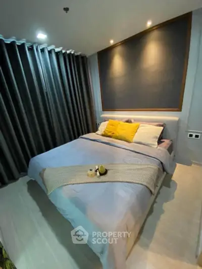 Cozy modern bedroom with stylish decor and ambient lighting