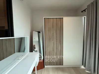 Modern bedroom with sleek wardrobe and stylish vanity set