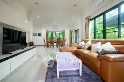 Spacious modern living room with large windows and elegant decor