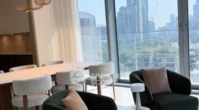 Modern living room with city view, elegant furniture, and natural light.