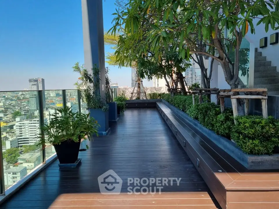 Stunning rooftop garden with panoramic city views and lush greenery.
