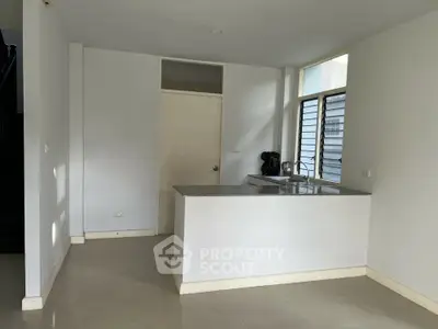 Minimalist kitchen with open layout and natural light