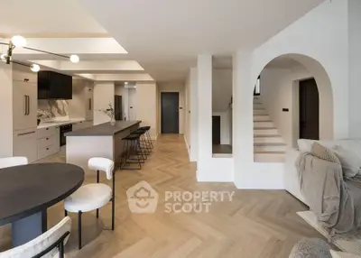 Spacious open-plan kitchen and living area with modern design and elegant finishes.