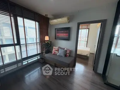 Modern living room with stylish decor and large windows for natural light