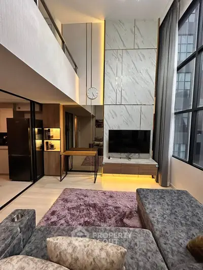Luxurious modern living room with high ceilings and elegant decor in a stylish apartment.
