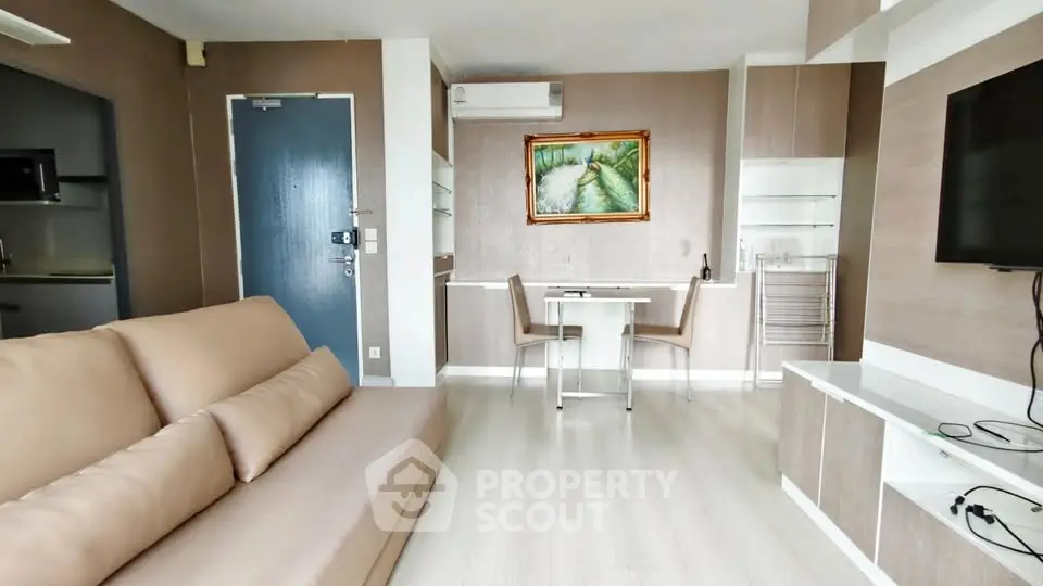 Modern living room with sleek furniture and stylish decor in a contemporary apartment.