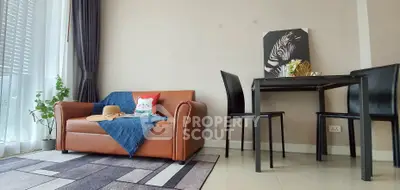 Stylish living room with cozy sofa and modern dining area, perfect for urban living.