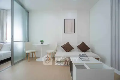Modern living room with minimalist decor and cozy seating area