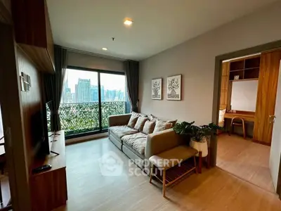 Modern living room with city view, cozy sofa, and stylish decor in a high-rise apartment.