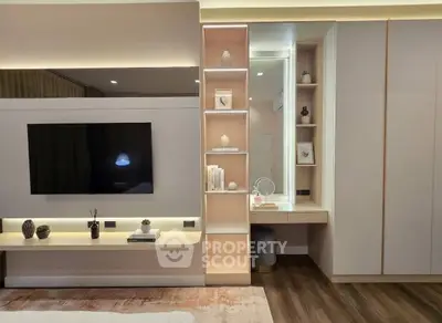 Modern bedroom with built-in TV and stylish shelving unit