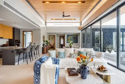 Luxurious open-plan living room with modern kitchen and elegant decor