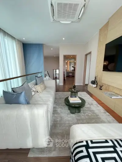 Luxurious modern living room with elegant decor and spacious layout, perfect for relaxation and entertainment.