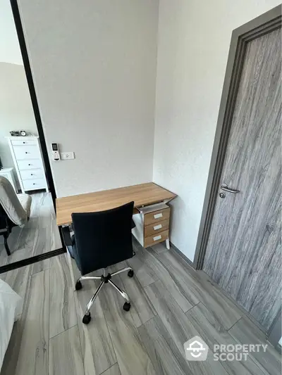 Cozy study nook with modern desk and chair in stylish apartment