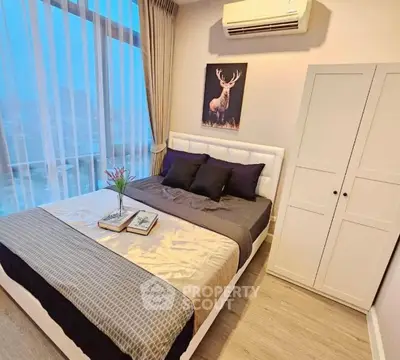 Modern bedroom with large window and stylish decor