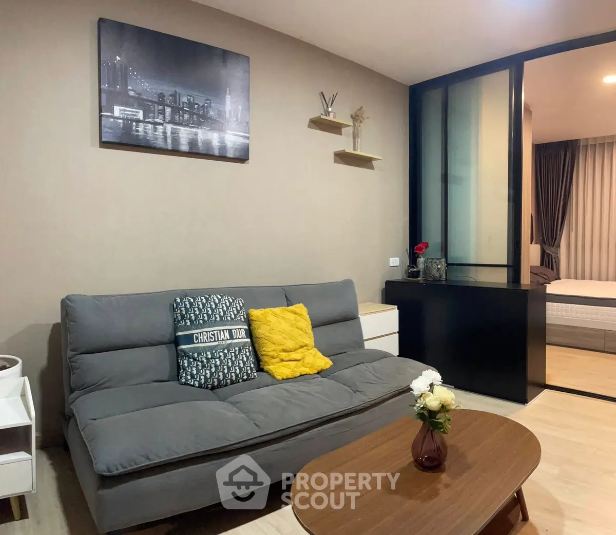 Modern living room with stylish decor and cozy seating in a contemporary apartment.