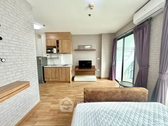 Modern studio apartment with open kitchen and cozy living area