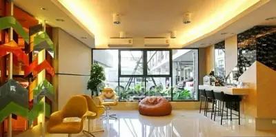 Modern living room with stylish decor and large windows offering natural light.
