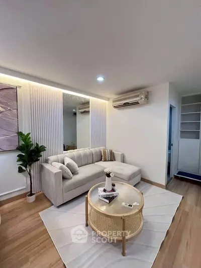 Modern living room with stylish decor and cozy seating area, perfect for relaxation and entertaining.