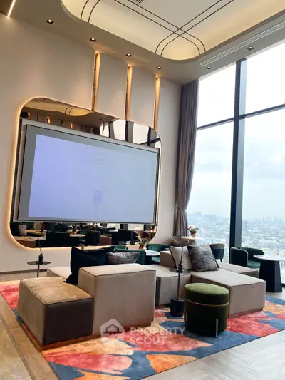 Luxurious living room with high ceilings and panoramic city view, featuring modern furniture and vibrant decor.