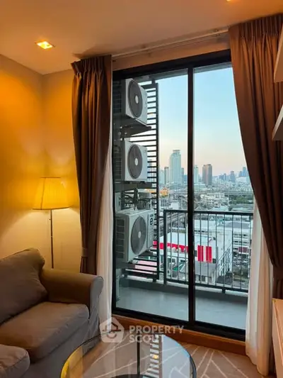 Cozy living room with city view from balcony, featuring modern decor and comfortable seating.