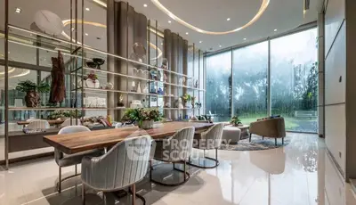 Luxurious modern living room with elegant decor and large glass windows overlooking a serene garden.