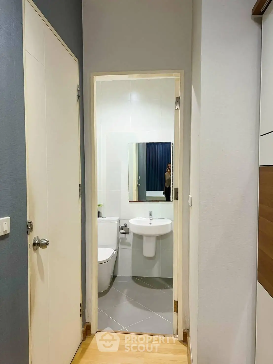 Compact bathroom with modern fixtures and sleek design in a contemporary apartment.