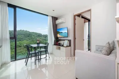 Modern living room with stunning forest view, sleek furniture, and natural light.