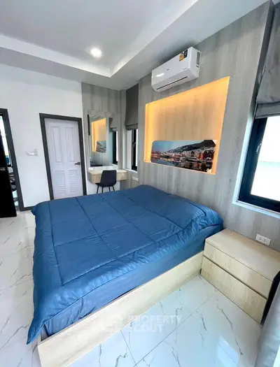 Modern bedroom with stylish decor and natural light