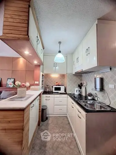 Charming kitchen with modern appliances and cozy design, perfect for culinary enthusiasts.