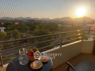 Stunning balcony view with sunset over cityscape, perfect for relaxation and enjoying outdoor moments.