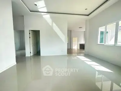 Spacious and bright living room with modern design and large windows