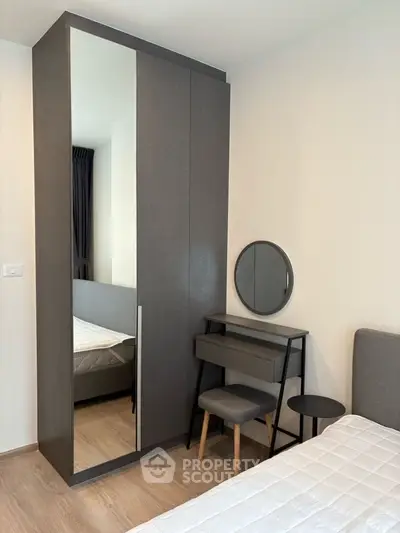 Modern bedroom with sleek wardrobe and stylish vanity set