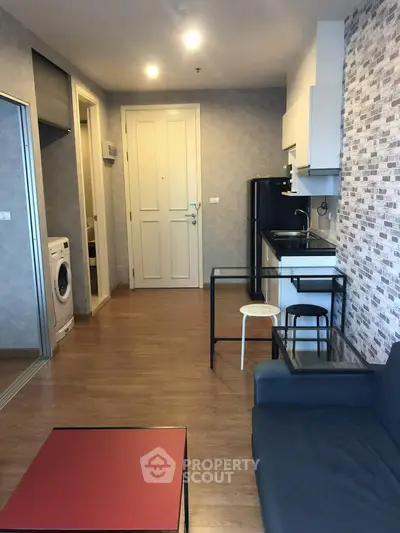 Modern apartment interior with open kitchen and cozy living area