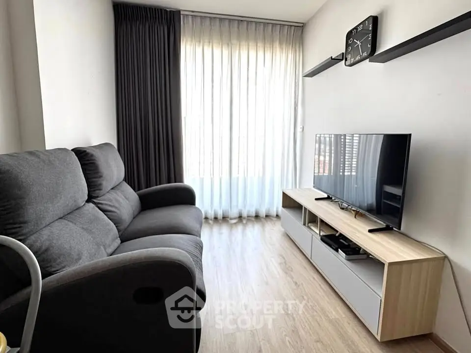 Modern living room with sleek furniture and natural light