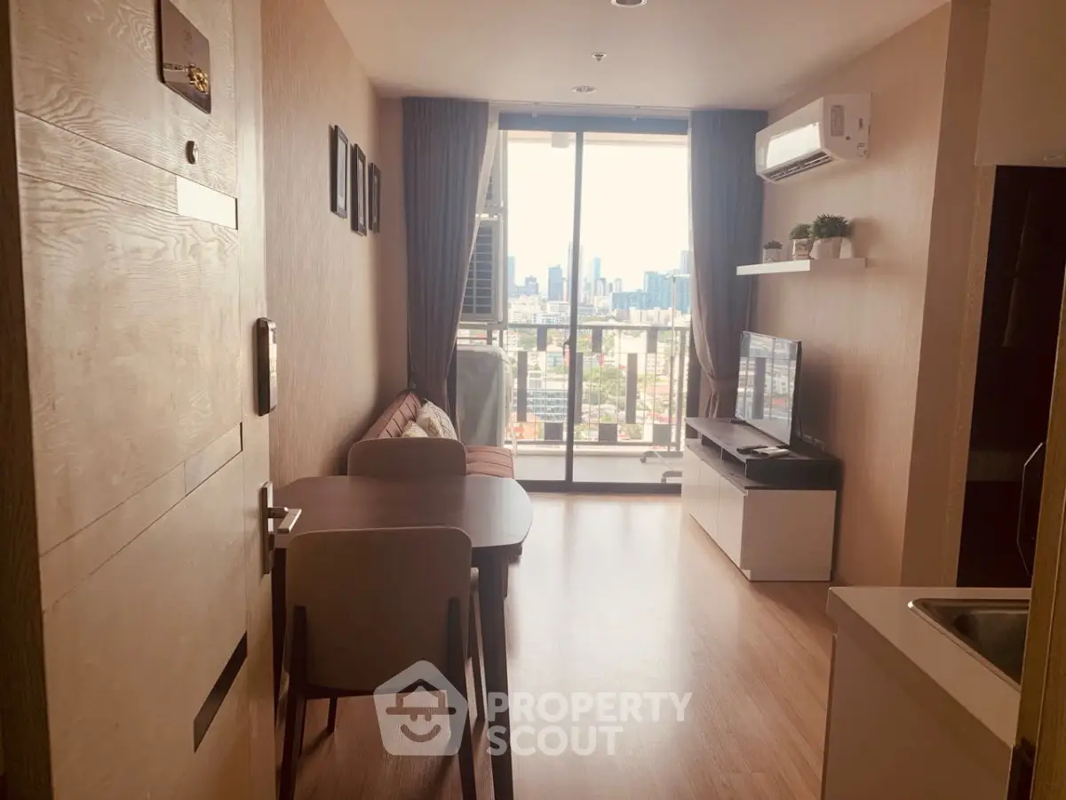 Modern living room with city view, featuring cozy furniture and natural light.