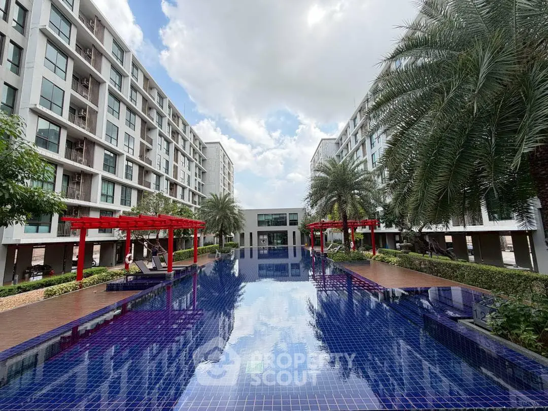 Luxurious condominium with stunning pool and modern architecture, perfect for urban living.